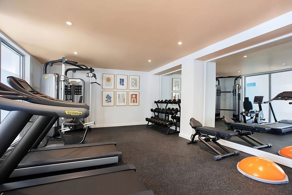 Recharge with a focused workout in a bright, modern gym.