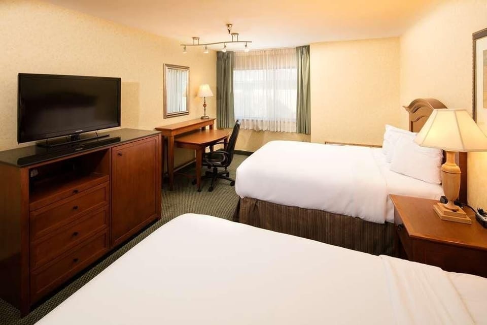 Catch up on work at the desk, then unwind in bed.