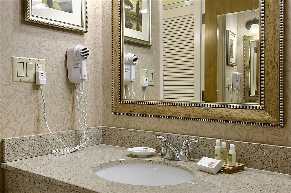 Freshen up easily with a wide vanity and bright mirror.