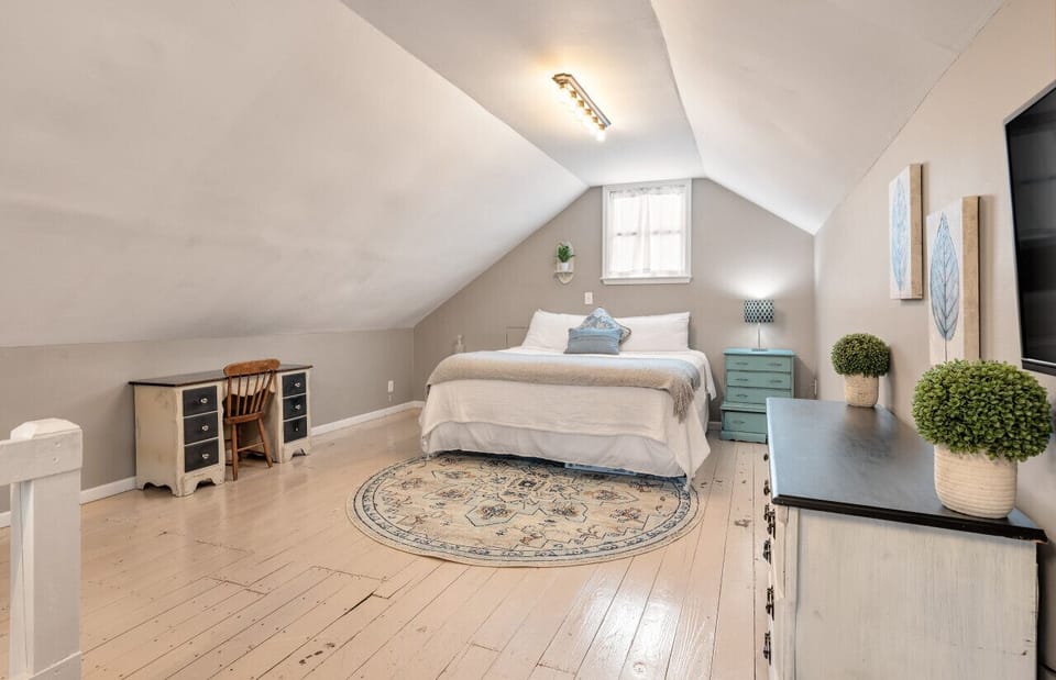 [Bedroom] King bed, loft-style, living area behind this photo view