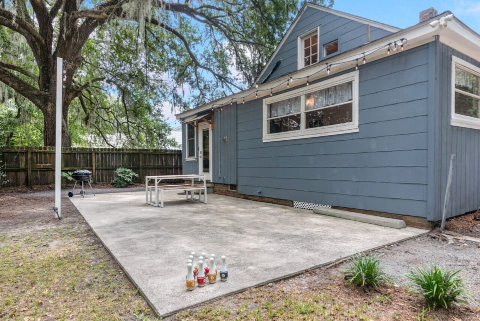 [Patio] Unit entrance, charcoal BBQ, space shared with front unit