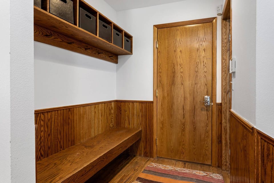 The entry way from the garage offers ample storage for a large group.