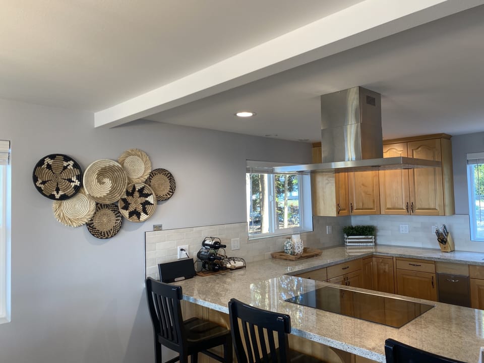 view of kitchen and breakfast bar from dining room