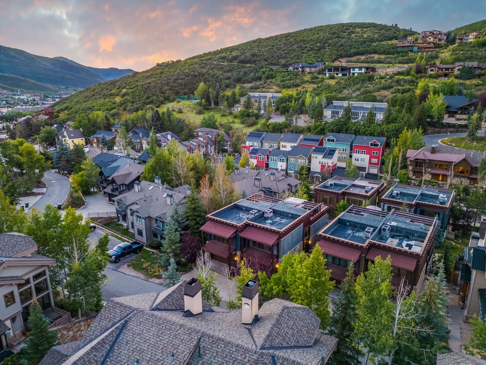Stylish lofts nestled in a colorful hillside community near trails and town.