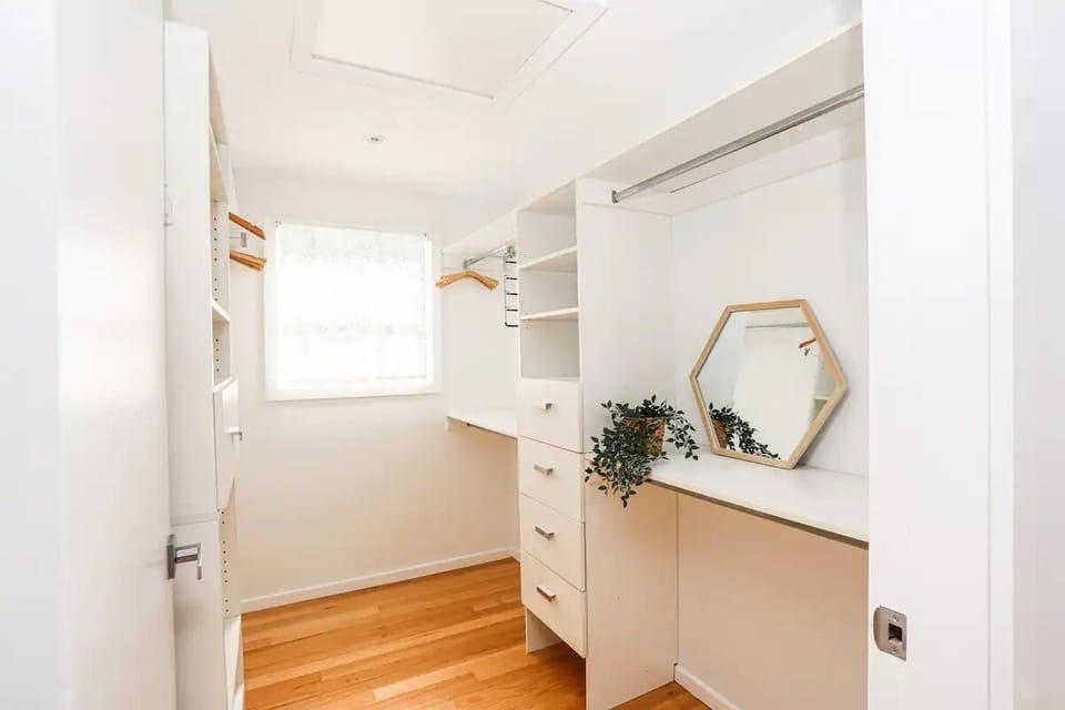 Walk in wardrobe in main bedroom. 