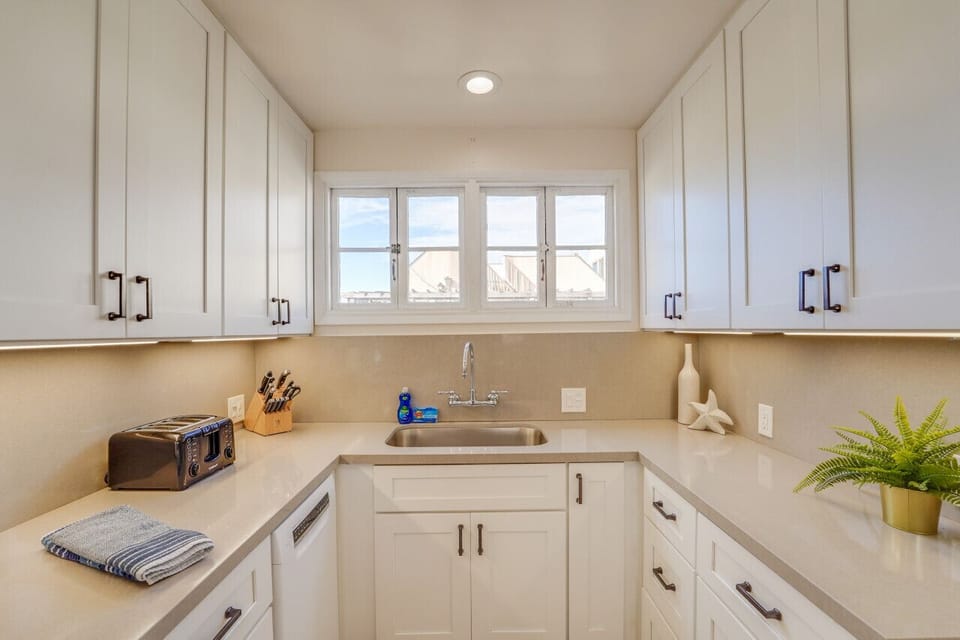 Kitchen has counter top seating and everything you need to prepare a meal at home!