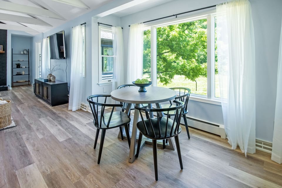 Breakfast nook in front of picture window with seating for 4