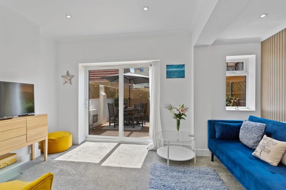 Spacious lounge opening onto courtyard garden