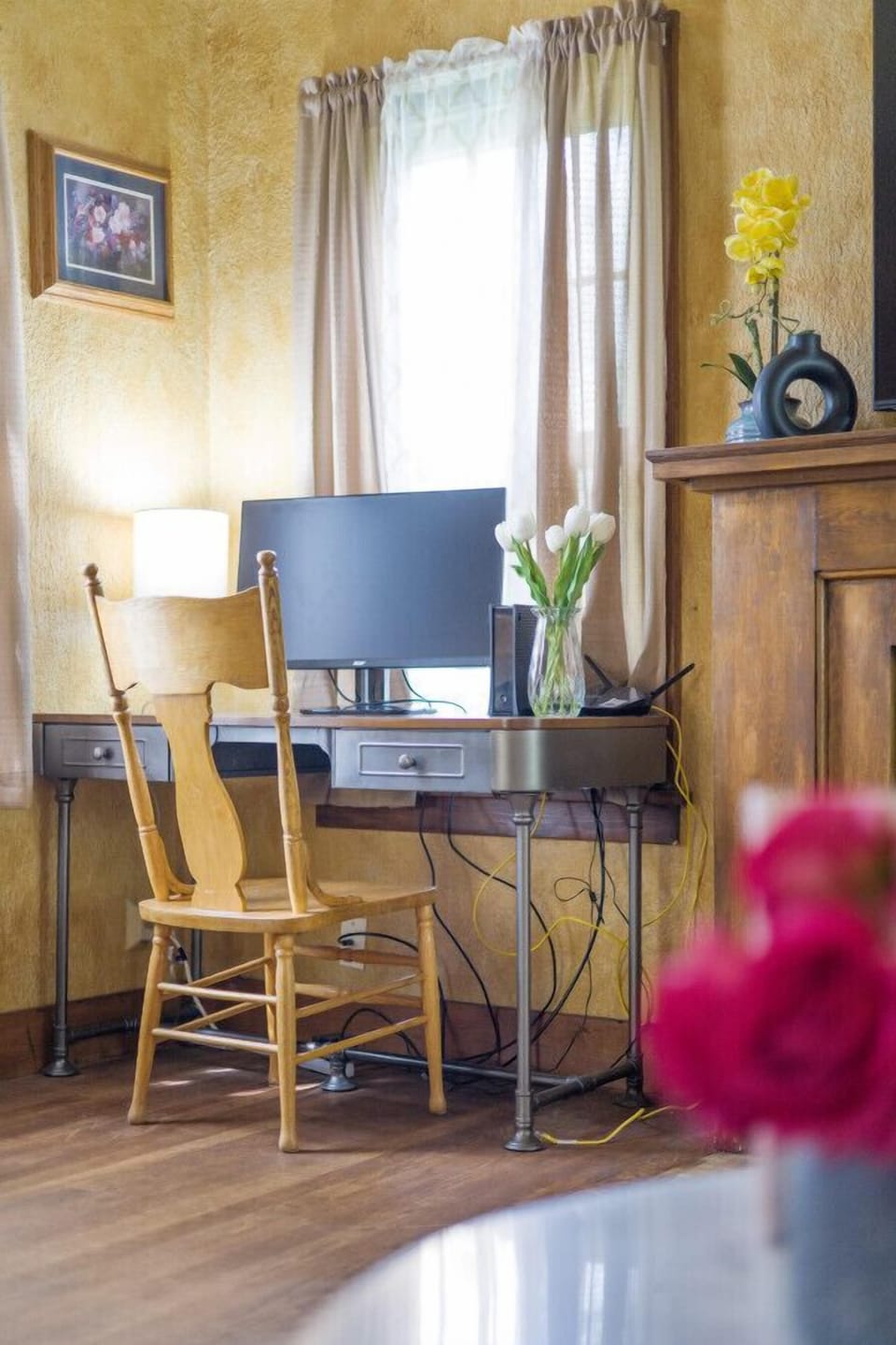 Desk in the living room with monitor