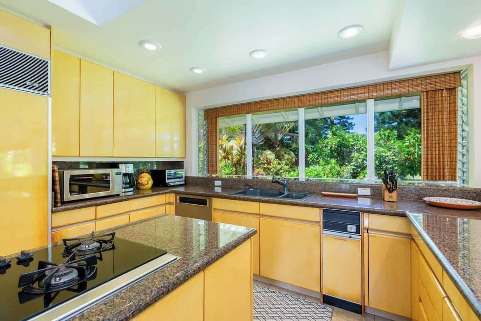 Cook with joy surrounded by scenic beauty of Makai Golf course, transforming your culinary experience into a delightful visual feast