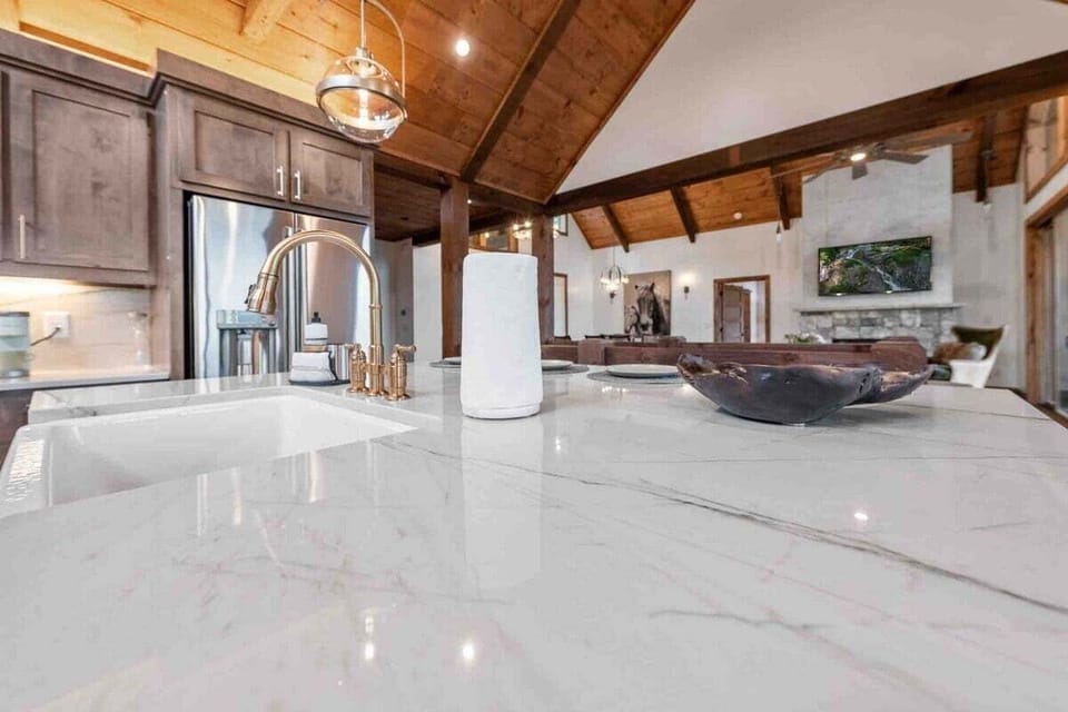 Luxurious marble countertops, custom lighting and designer fixtures add elegance and charm.
