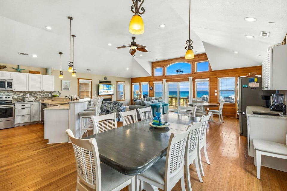 Oceanfront living area with cathedral ceilings. (Note: Fireplace is NOT available for guest use.)