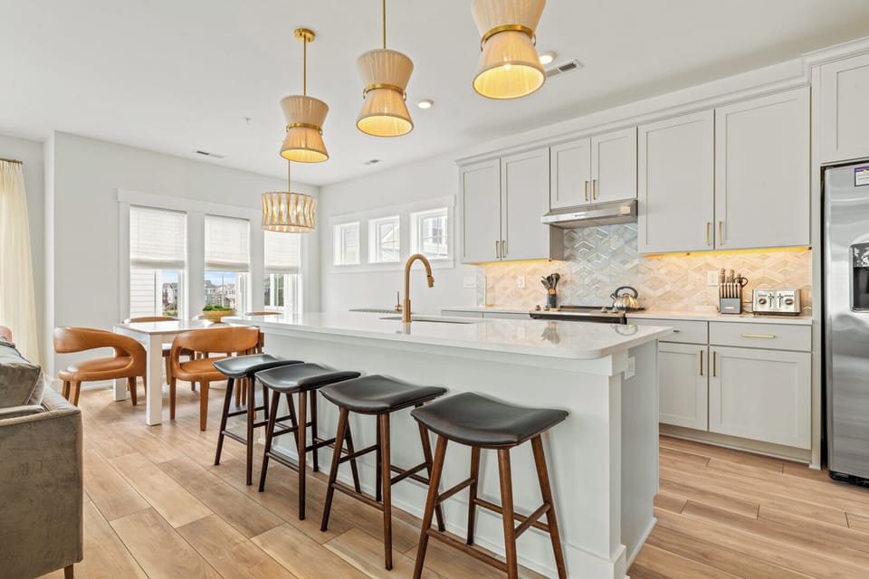 Kitchen with Bar Seating on Third Level