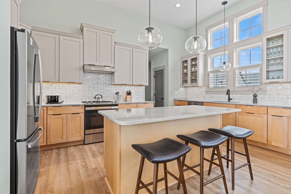Kitchen with Bar Stool Seating on Third Floor