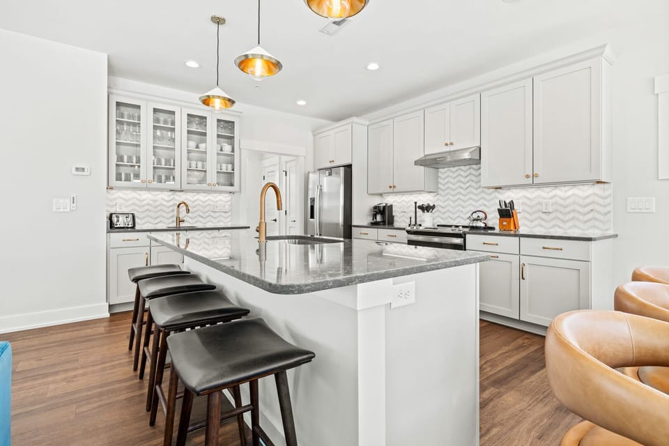 Kitchen with Bar Seating on Third Level