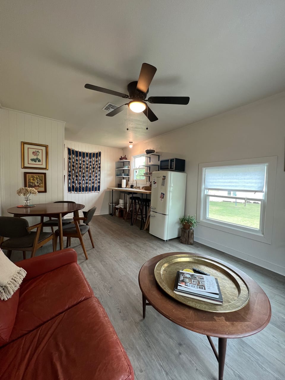 Opposite view of living, dinning areas + kitchenette. 