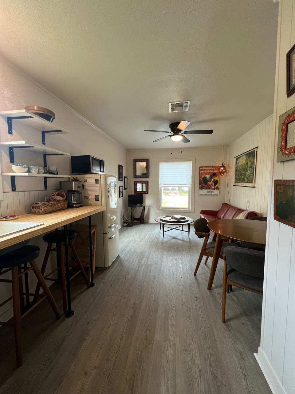 Kitchenette leading into living and dining areas. 