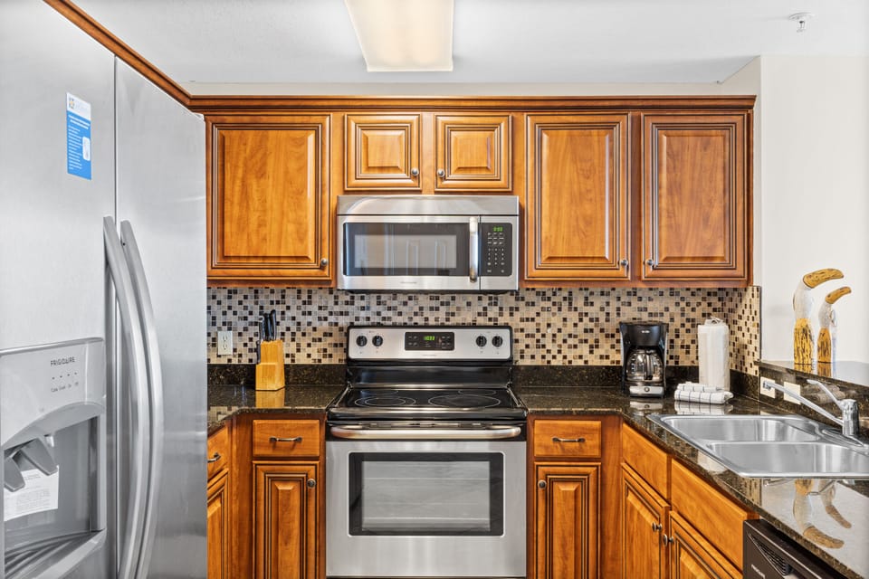 Kitchen - Prepare feasts with ease in this elegant kitchen, outfitted with top-notch appliances,and a full suite of cooking essentials.