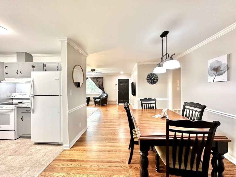 Kitchen essentials, dining for 4, carport access. Cozy living room setup.