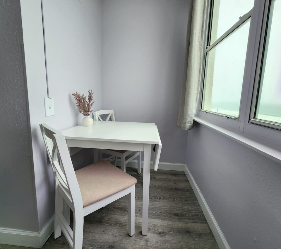 Separate eat-in-kitchen space with a view of the ocean. Table leafs can expand.