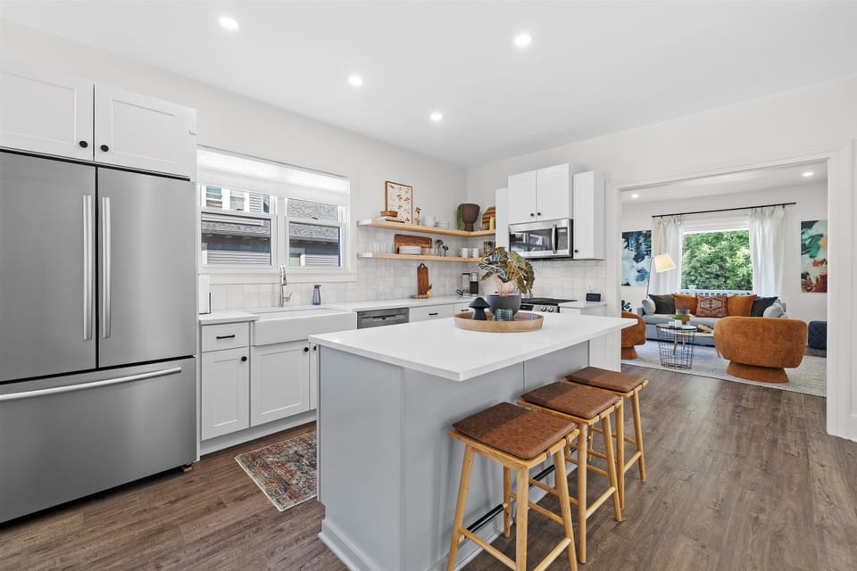 Fully stocked kitchen with counter seating and built in breakfast nook