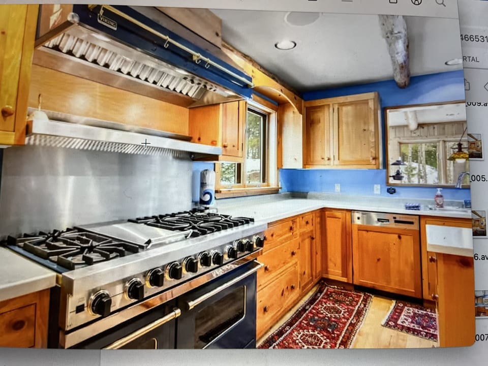View of the kitchen cooking space;  notice the chefs dream stove-top range!