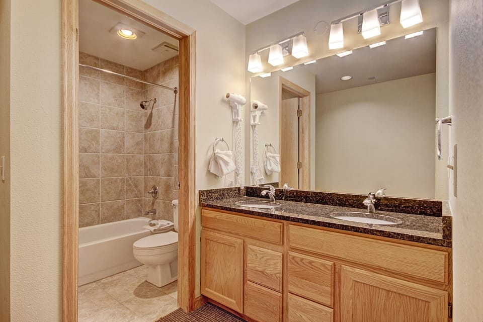 Get ready for the day ahead in the bright full bathroom.
