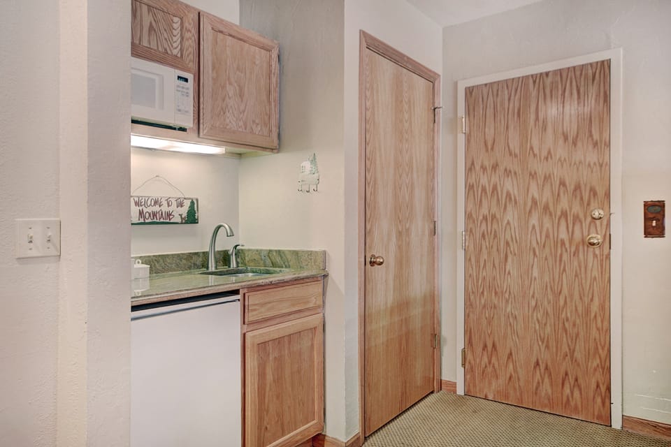 Keep refreshments and snacks chilled in the mini fridge.