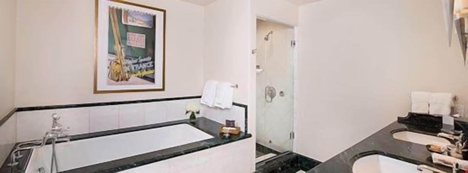 Pamper yourself in the 5-piece marble bathroom, complete with TV and plush bathrobes.