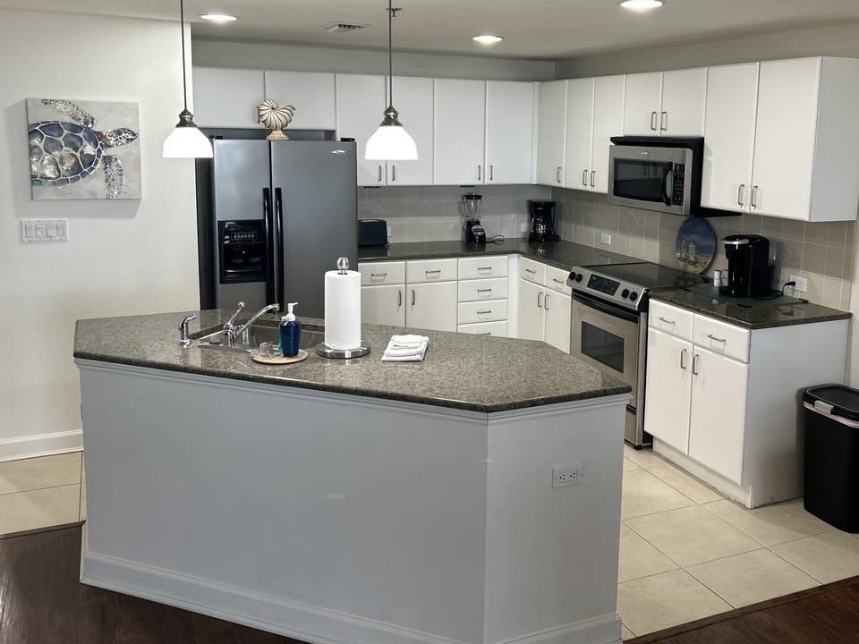Kitchen includes Keurig coffee maker plus Regular coffee maker.