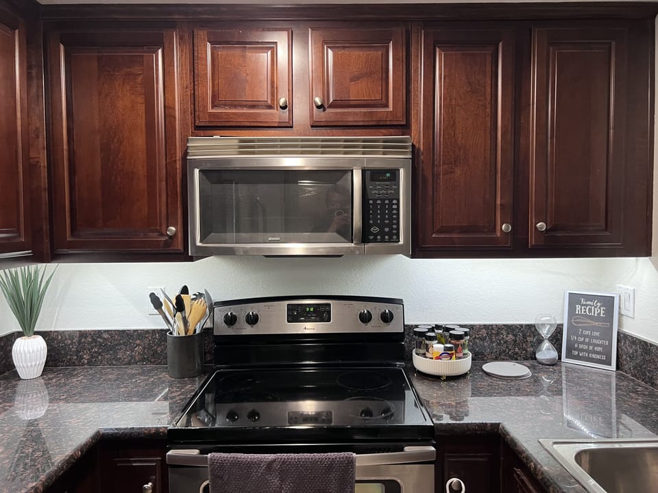 Kitchen comes with spices, dishware, pots and pan 