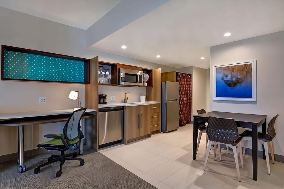 Settle in with a full kitchenette, dining table, and work desk.