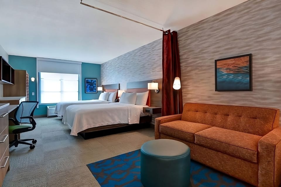 Stretch out with two comfy beds and a cozy sofa.