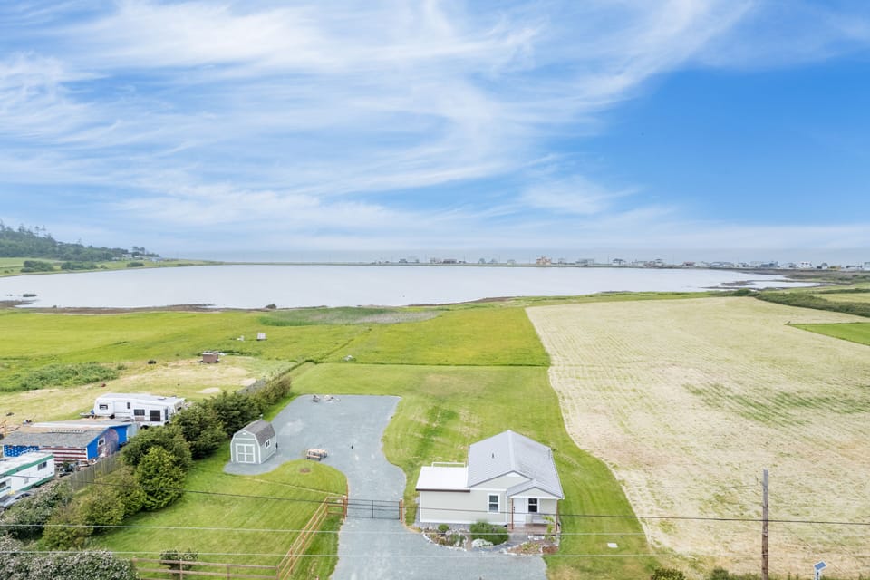 Gaze across Swan Lake towards the Sound, framed by the majestic Olympic Mountains.