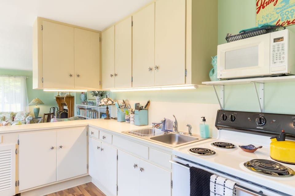 Kitchen boast an oven for preparing delightful snacks.