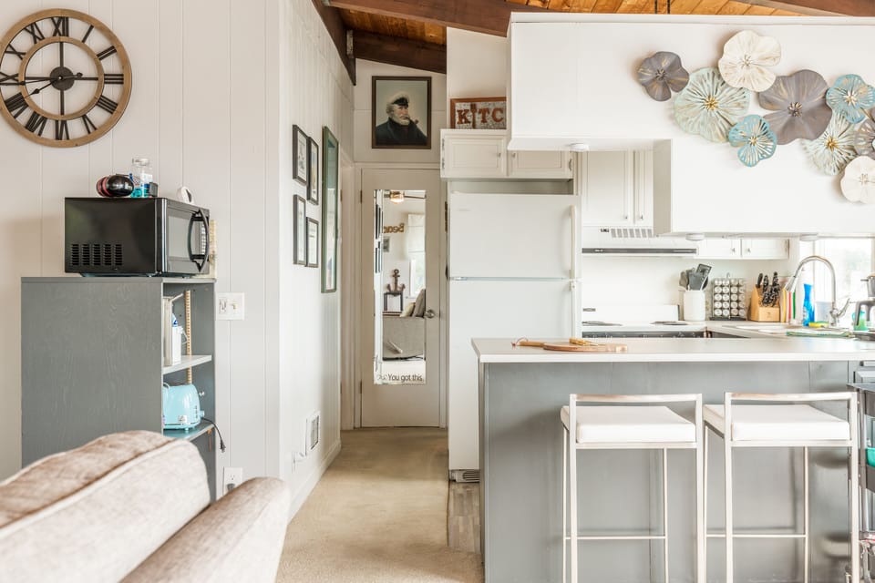 Additional barstool seating at the kitchen counter.