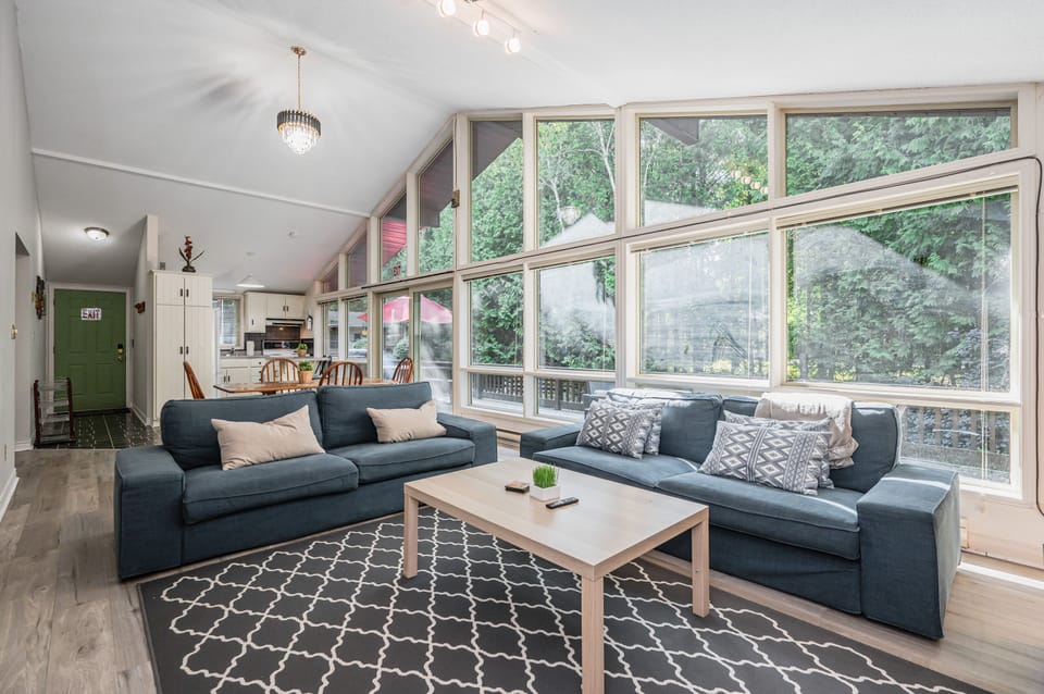 The sitting area is spacious and the large windows provide a truly stunning view. 