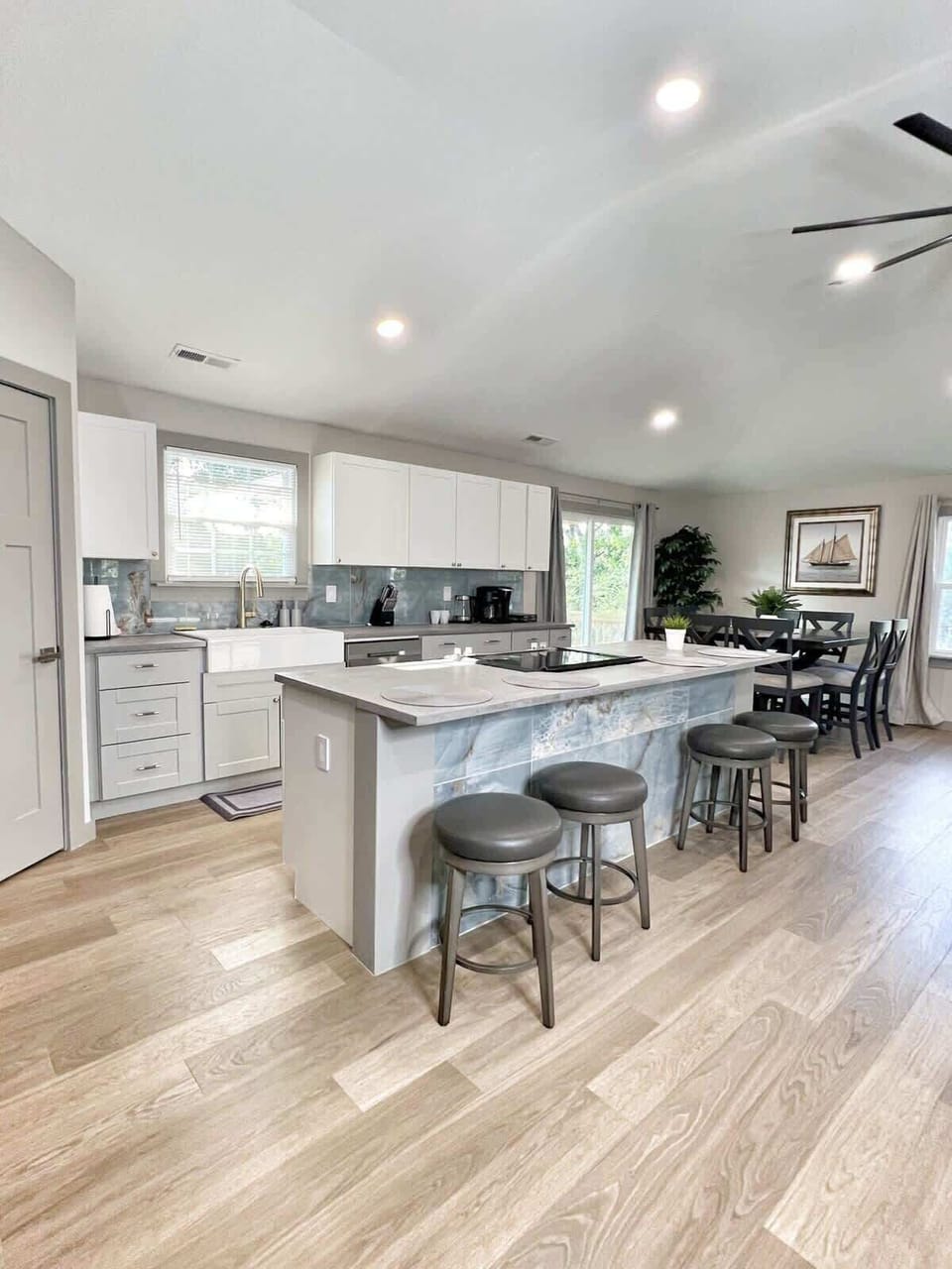 Modern kitchen with stainless appliances and farmhouse charm.