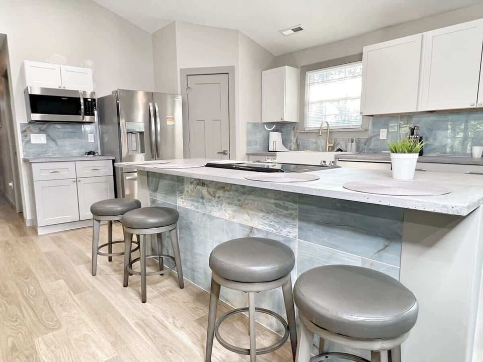 Organized cabinets with plenty of dishes for large groups.