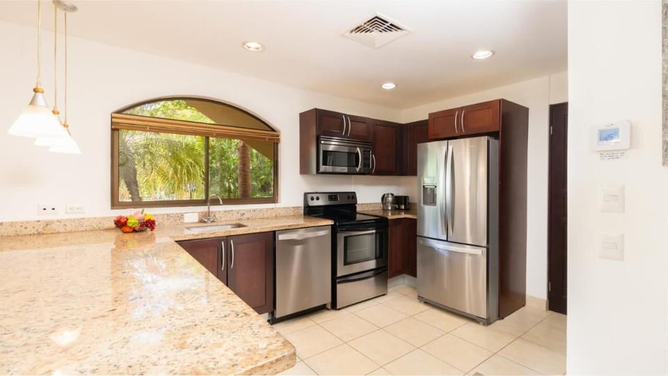 Large kitchen, full-size fridge, ice maker, stove, microwave and dishwasher.
