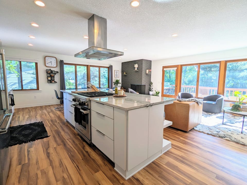 Open concept kitchen, living and dining area overlooking the Mississippi River