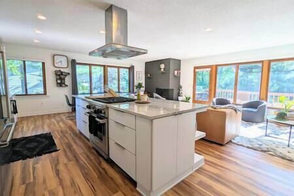 Open concept kitchen, living and dining area overlooking the Mississippi River. 