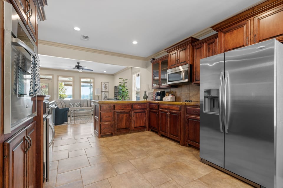 Welcome to our fully equipped kitchen featuring sleek stainless steel appliances