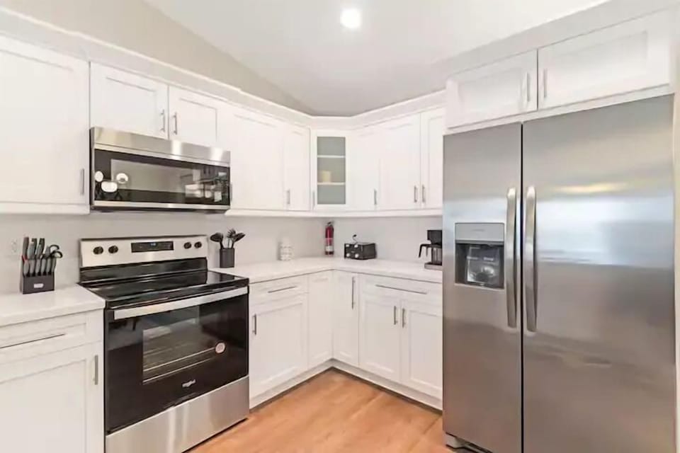  stove, oven, microwave, toaster, coffee maker, refrigerator