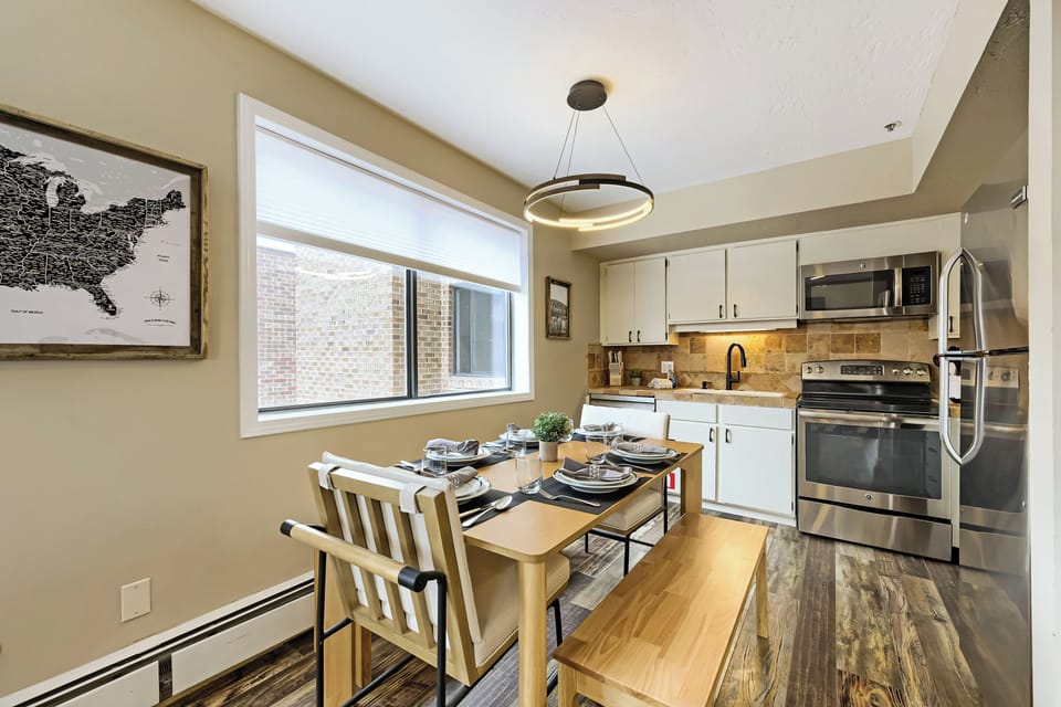 Picture yourself preparing a home-cooked meal in this fully equipped kitchen and dining for four at the cozy table. Modern appliances and warm lighting set the tone for your stay.