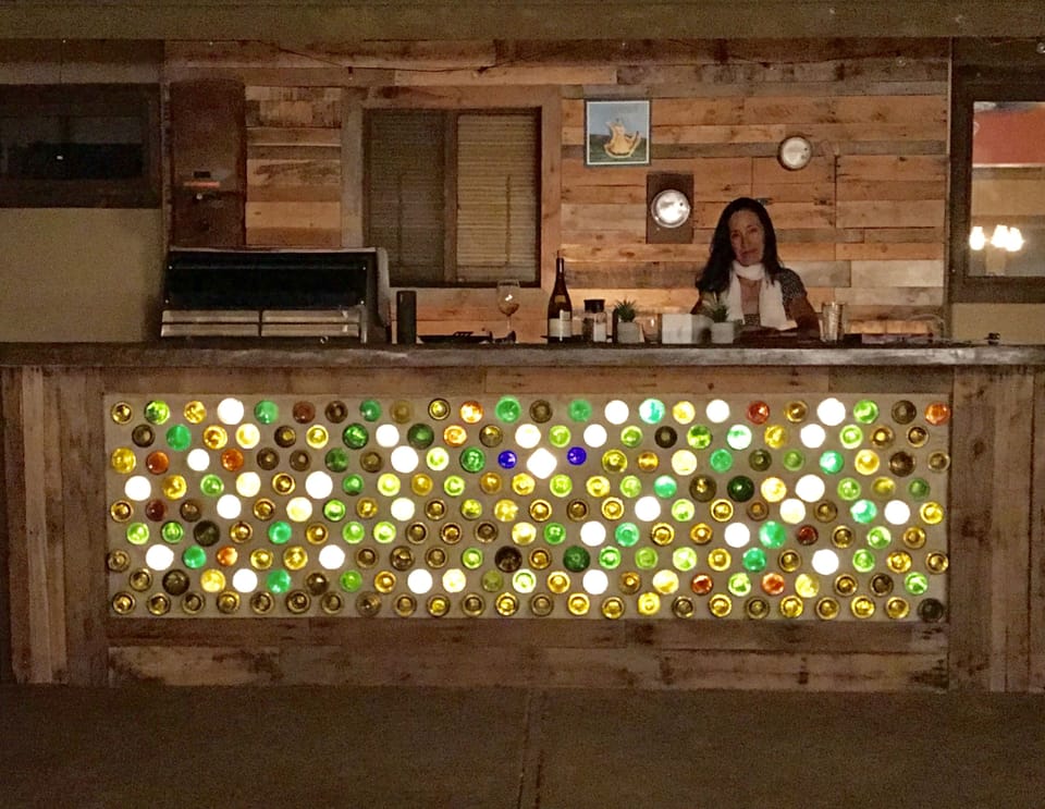 Bottle wall under the outdoor bar and bbq.