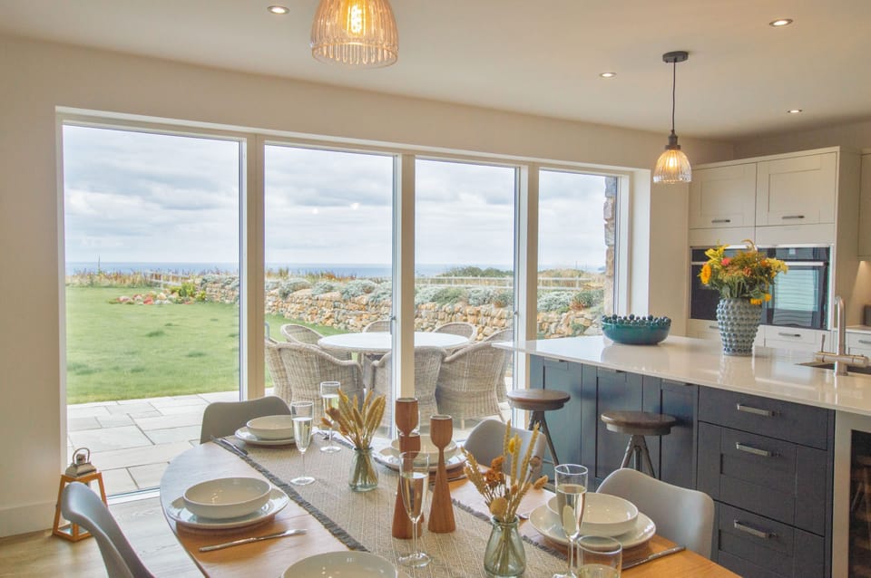 Polberro Cottage, Ground Floor: Large sliding doors connect the open-plan area to the beautiful garden