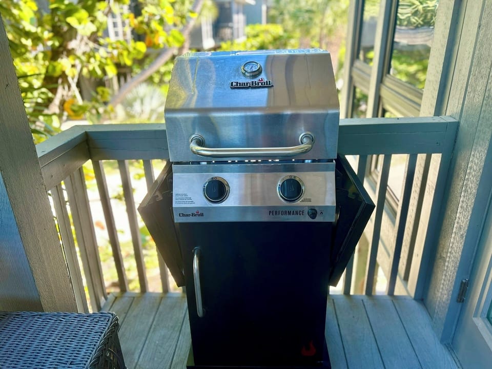 Gas grill on living room balcony 