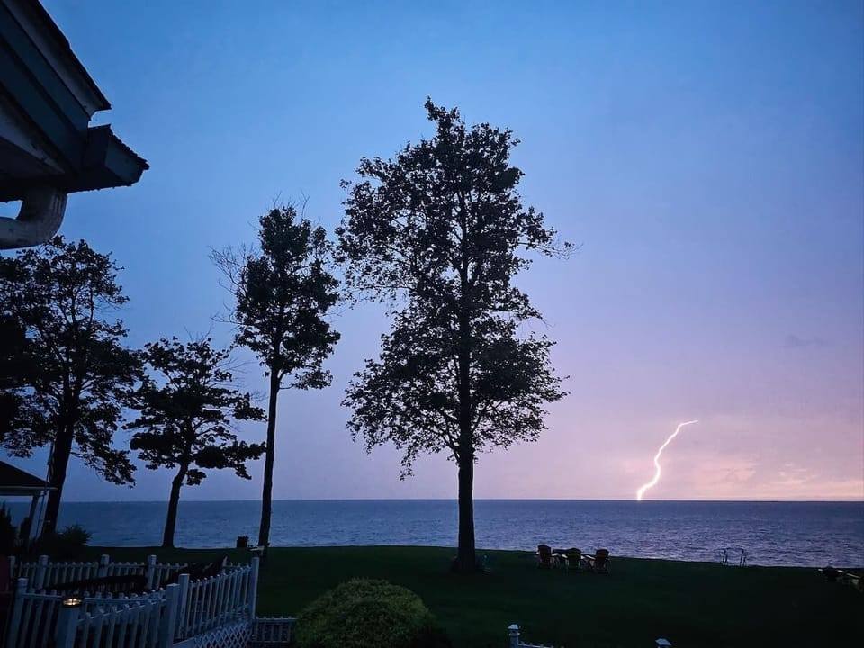 Lightening striking offshore during summer strom
