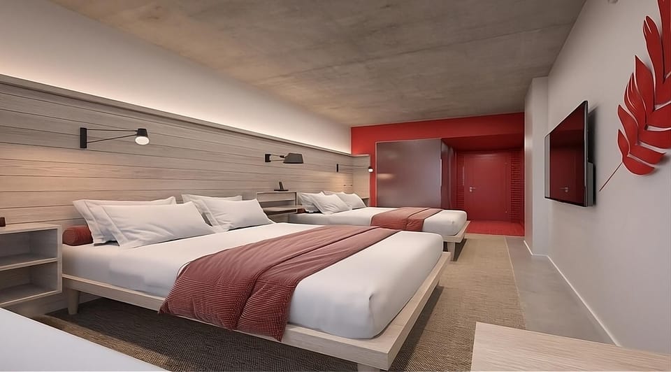 Lounge comfortably across multiple beds in a sleek, airy layout.